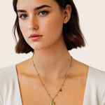 Gemini Gold Zodiac Tag Necklace by Lavana, on model; engraved tag front and back on beaded chain