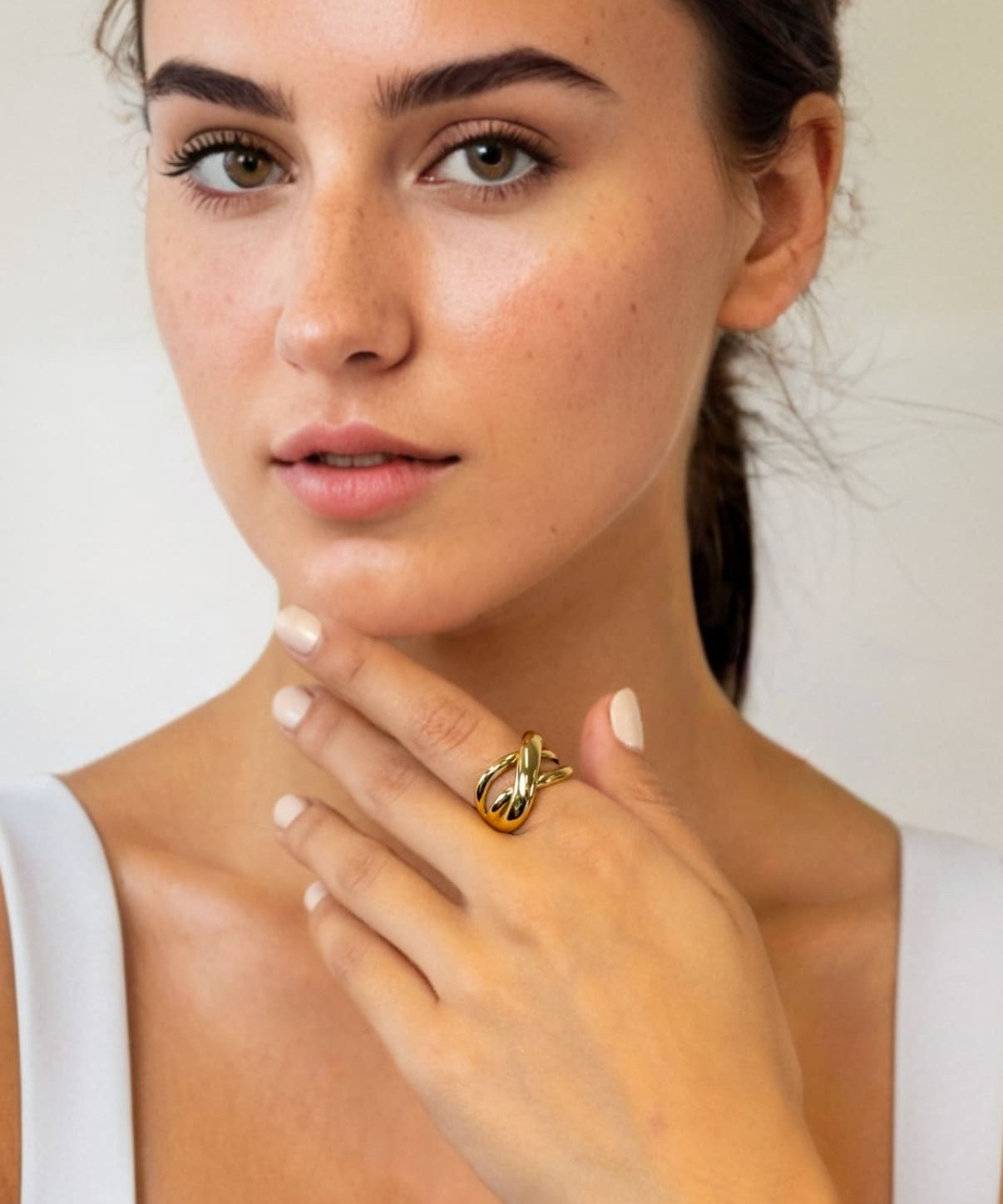 Glide Gold Chunky Crossover Statement Ring by Lavana on model with polished curves