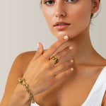 Glide Gold Chunky Crossover Statement Ring by Lavana on model with polished curves