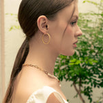 Grace Gold Hoop Earrings by LAVANA, on model; large lightweight dress hoops with diagonal grooves