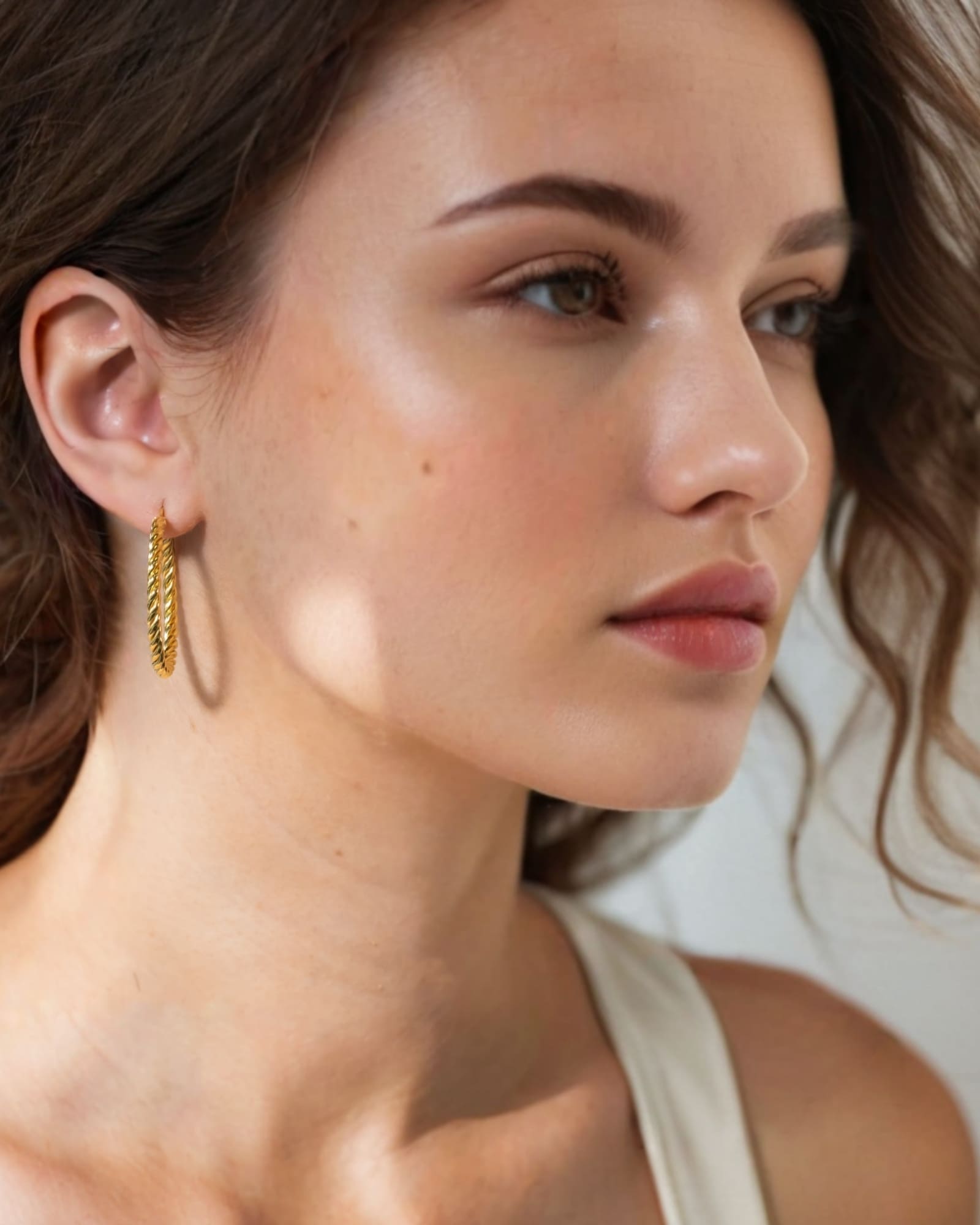 Grace Gold Hoop Earrings by Lavana on model large lightweight hoops with diagonal grooves