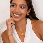 Guiding Stars Diamond Pendant by Lavana on model in 18k gold plated sterling silver with celestial star map