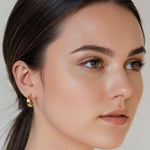Half Moon Gold Hoop Earrings by Lavana on model polished front with open lattice crescent