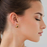 Half Moon Gold Hoop Earrings by Lavana on model polished front with open lattice crescent