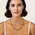 Harmony Gold Charm Necklace by Lavana, on model; paperclip and rolo mix with openable oval link