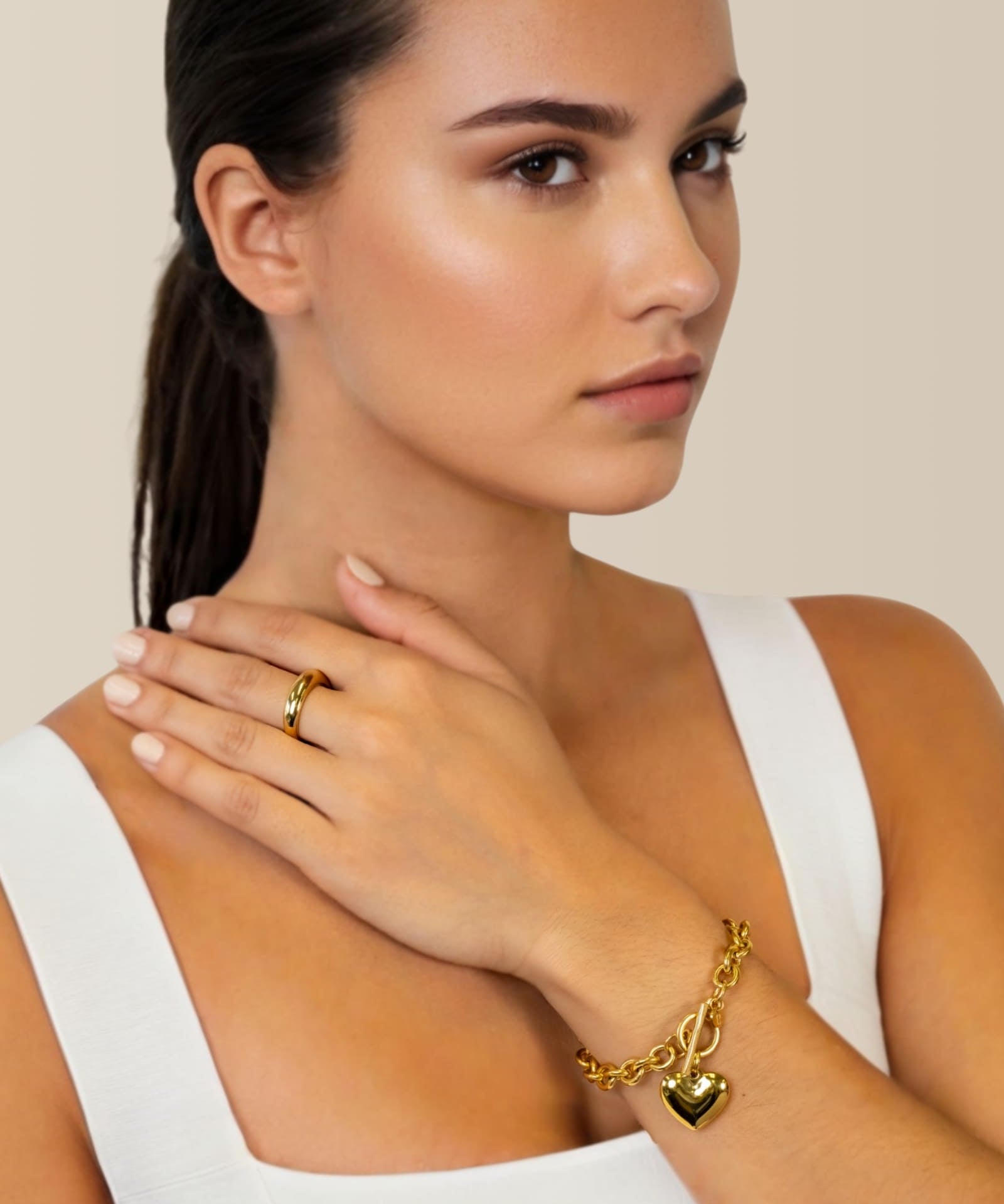 Heart Tag T-Bar Gold Chain Bracelet by Lavana on model rounded links with toggle clasp and heart charm