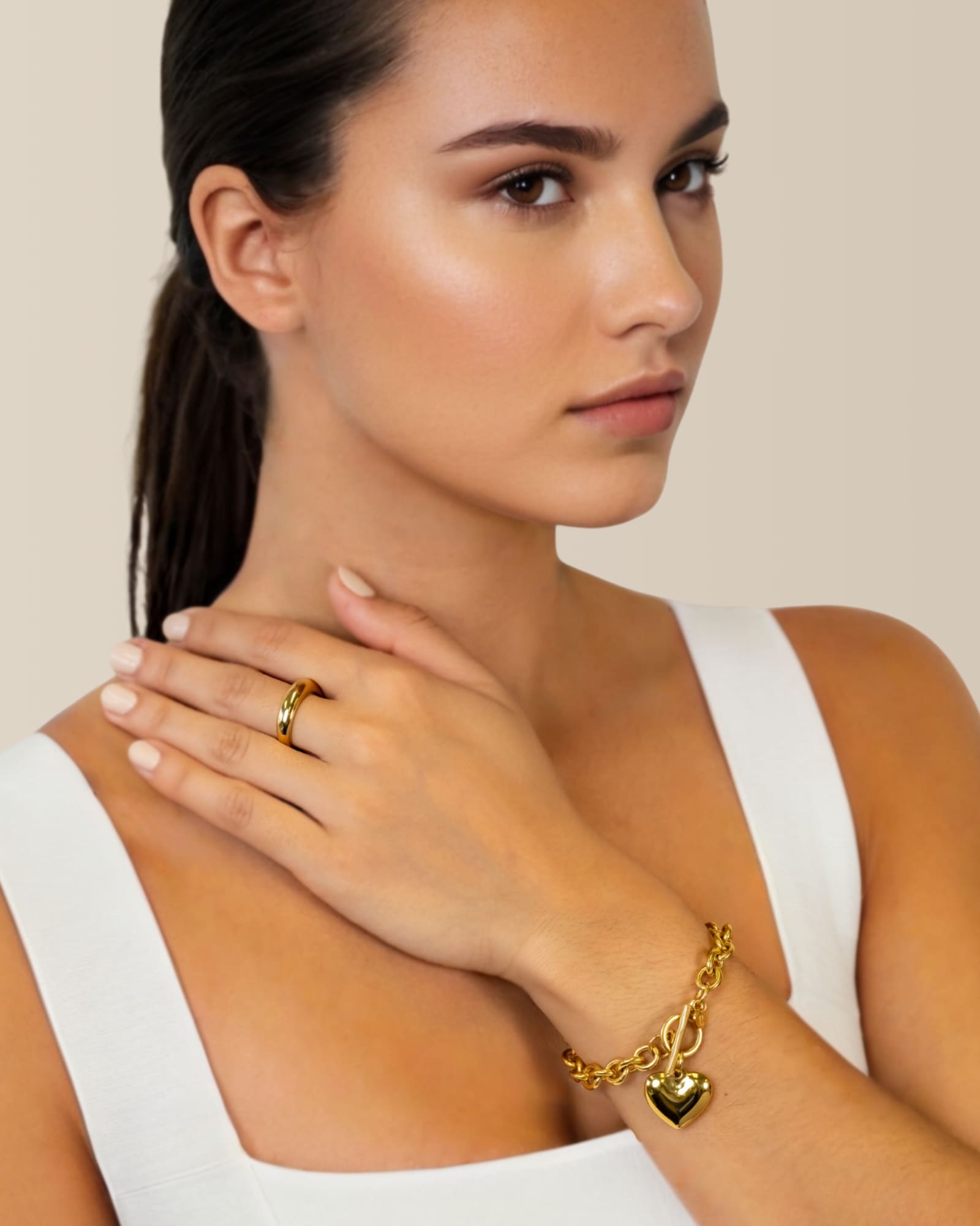 Heart Tag T-Bar Gold Chain Bracelet by Lavana on model rounded links with toggle clasp and heart charm