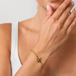 Heartlock Gold Paperclip Bracelet by LAVANA on model paperclip links with front heart T bar toggle