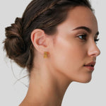 Horizon Gold Hoop Earrings by Lavana on model wide geometric hoops with jagged horizon lines