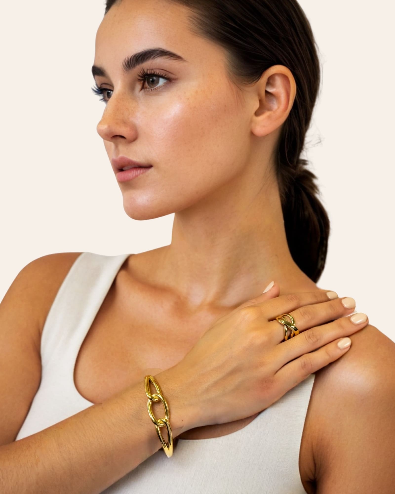 Infinity Link Gold Cuff Bracelet by Lavana on model with central interlocking link and polished finish