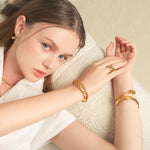 Infinity Link Gold Cuff Bracelet by Lavana, on model with modern central interlocking link and polished finish