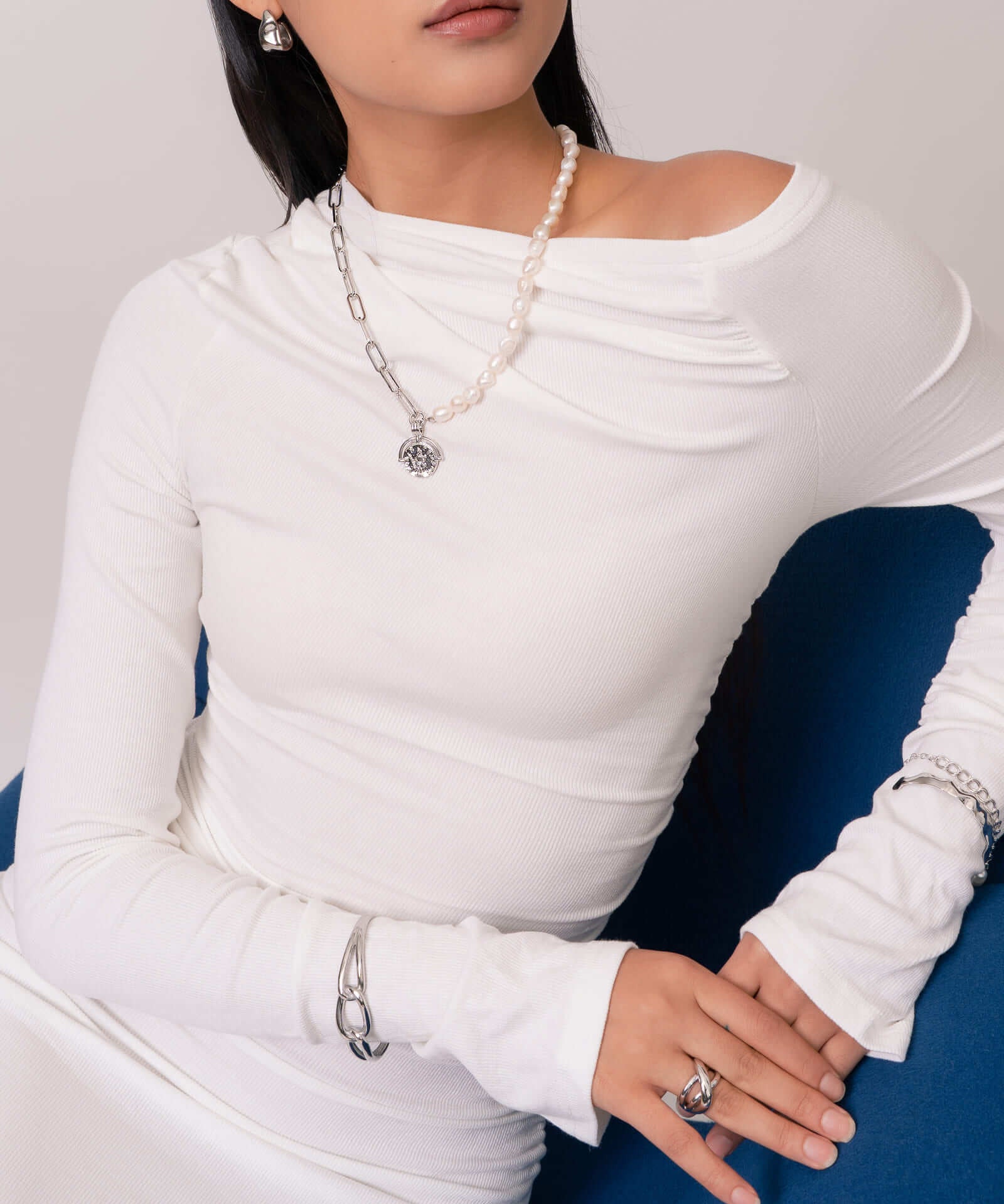 Infinity Link Silver Cuff Bracelet by Lavana, on model; with modern central interlocking link and polished coo