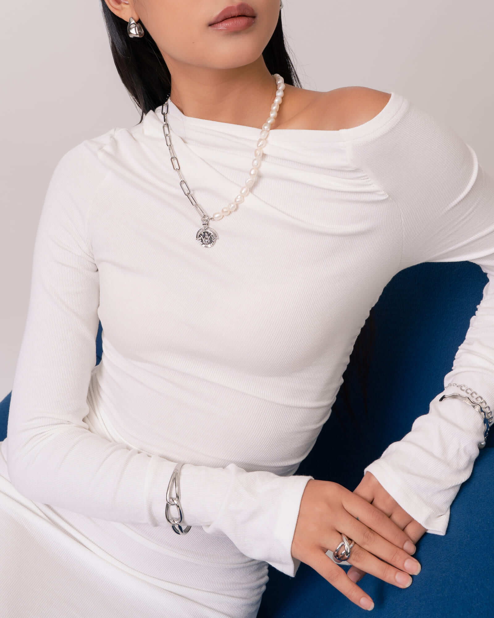 Infinity Link Silver Cuff Bracelet by Lavana, on model; with modern central interlocking link and polished coo