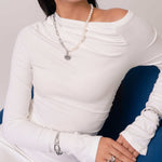 Infinity Link Silver Cuff Bracelet by Lavana, on model; with modern central interlocking link and polished coo