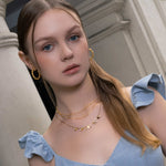 Interlace Gold Hoop Earrings by LAVANA, on model; large dress hoops with polished rope twist 