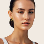Jojo Gold Oblong Earrings by Lavana, on model; ribbed top with polished oblong drop