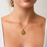 Journey Compass Pendant by LAVANA on model in 18k gold plated with map detail