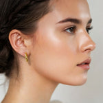 Kinetic Gold Hoop Earrings by Lavana on model domed half hoop with diagonal grooves