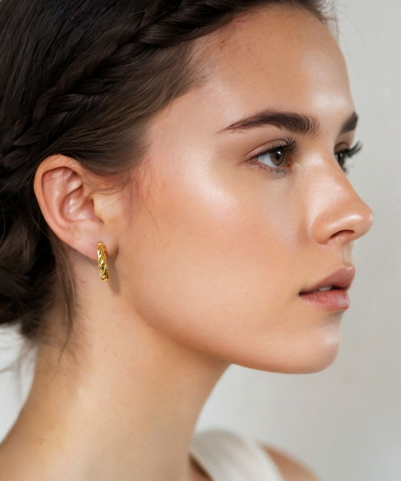 Kinetic Gold Hoop Earrings by Lavana on model domed half hoop with diagonal grooves