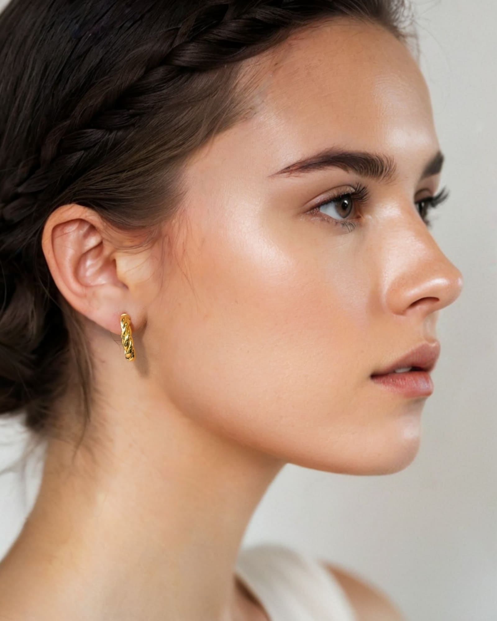 Kinetic Gold Hoop Earrings by Lavana on model domed half hoop with diagonal grooves