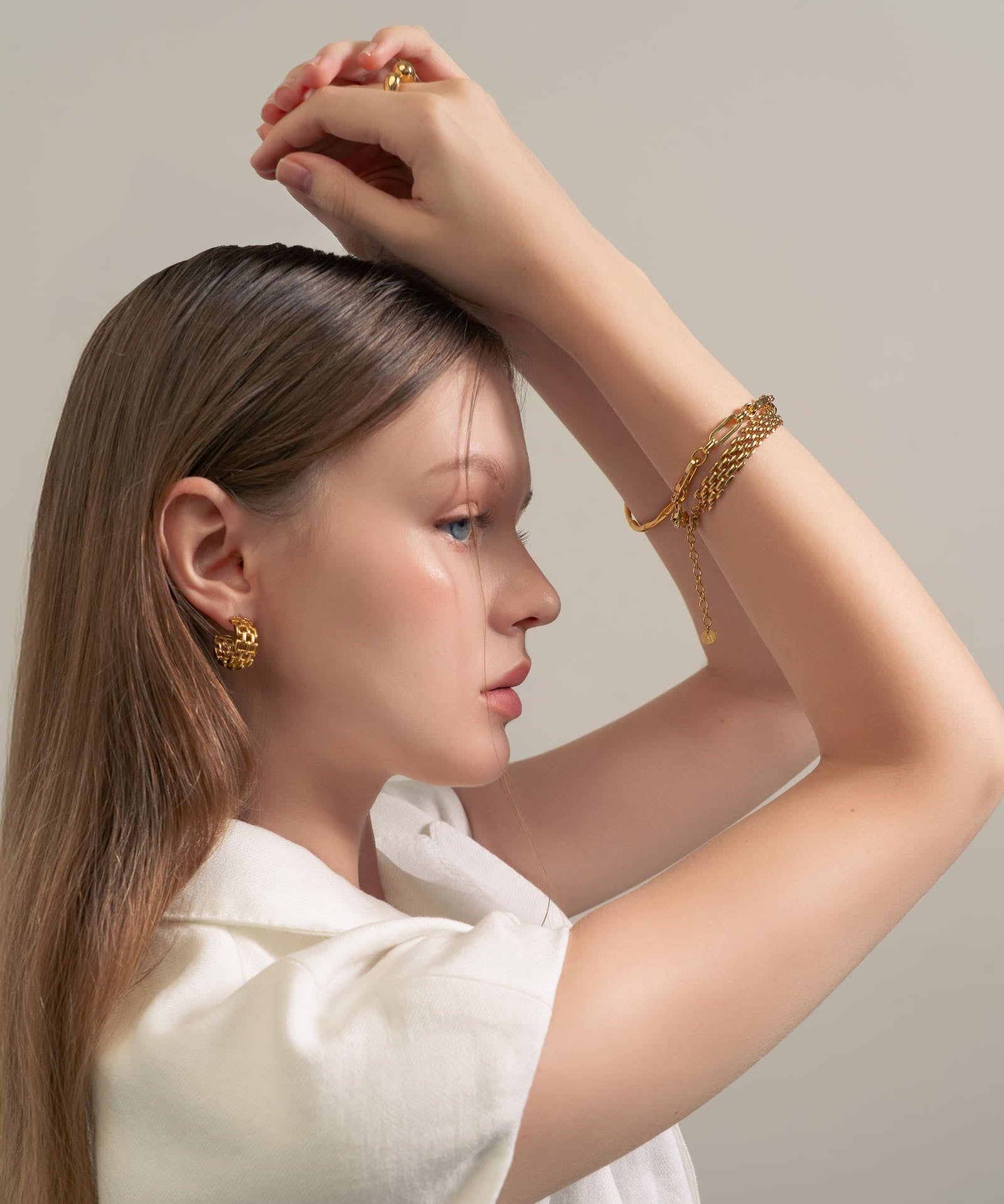 Latch Link Gold Bracelet by Lavana, on model modern elongated oblong links with four modern openable links for charms