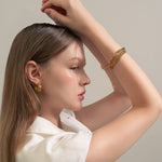 Latch Link Gold Bracelet by Lavana, on model modern elongated oblong links with four modern openable links for charms