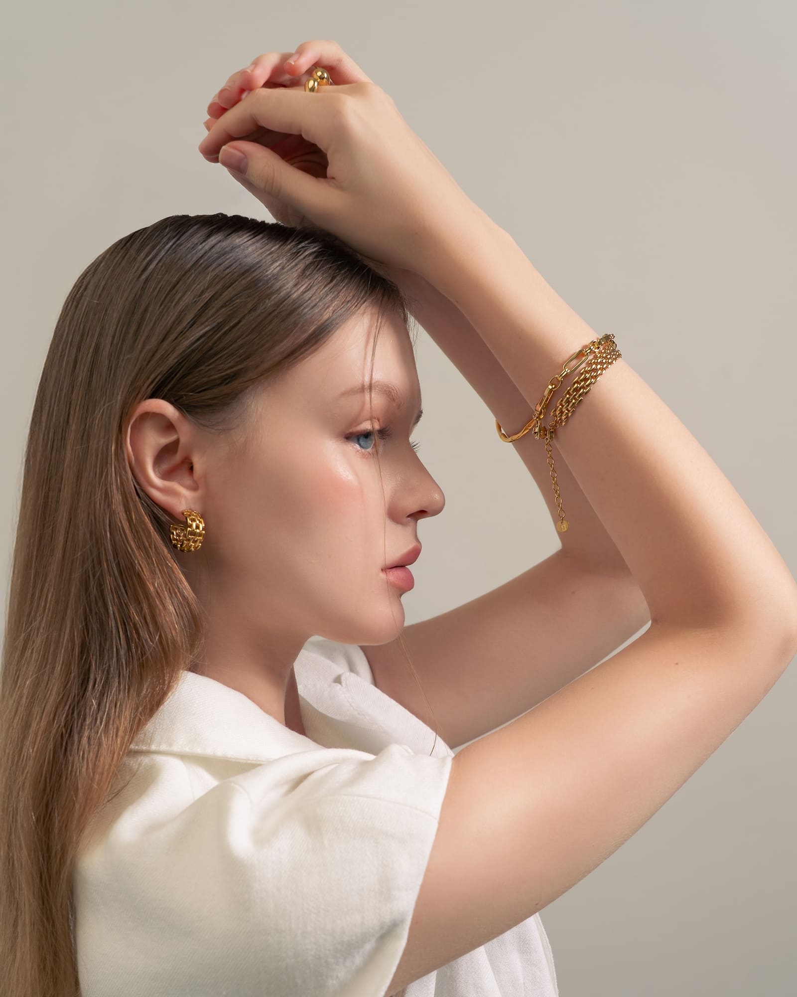 Latch Link Gold Bracelet by Lavana, on model modern elongated oblong links with four modern openable links for charms
