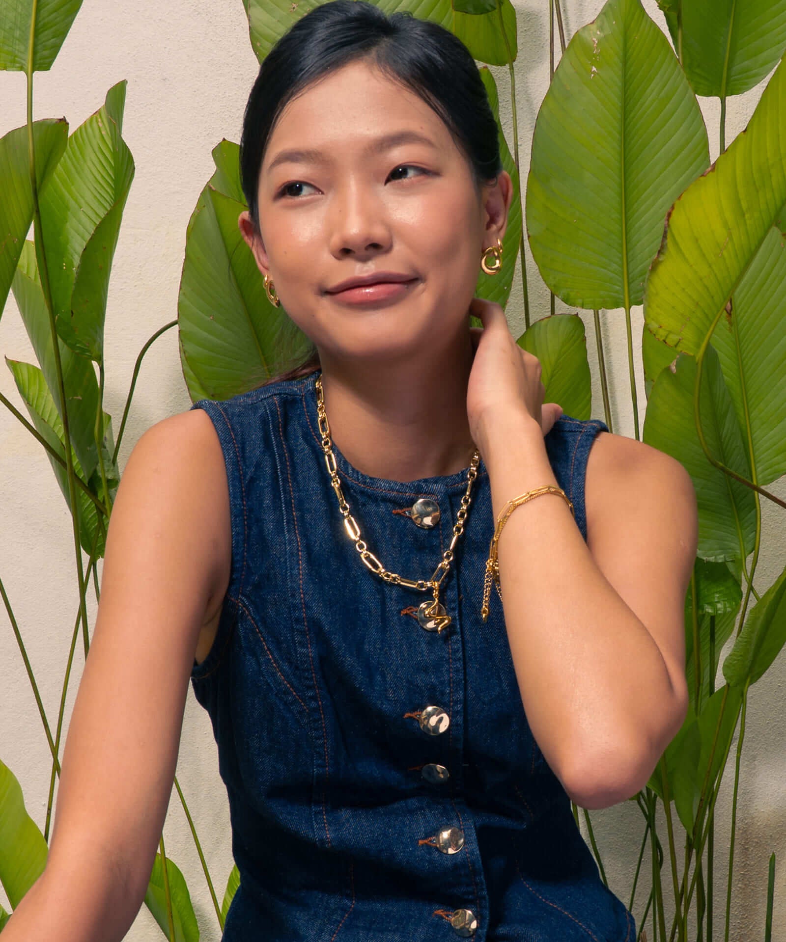 Latch Link Gold Necklace by Lavana, on model; paperclip chain five charm links Fluid pendant sculptural wave silho