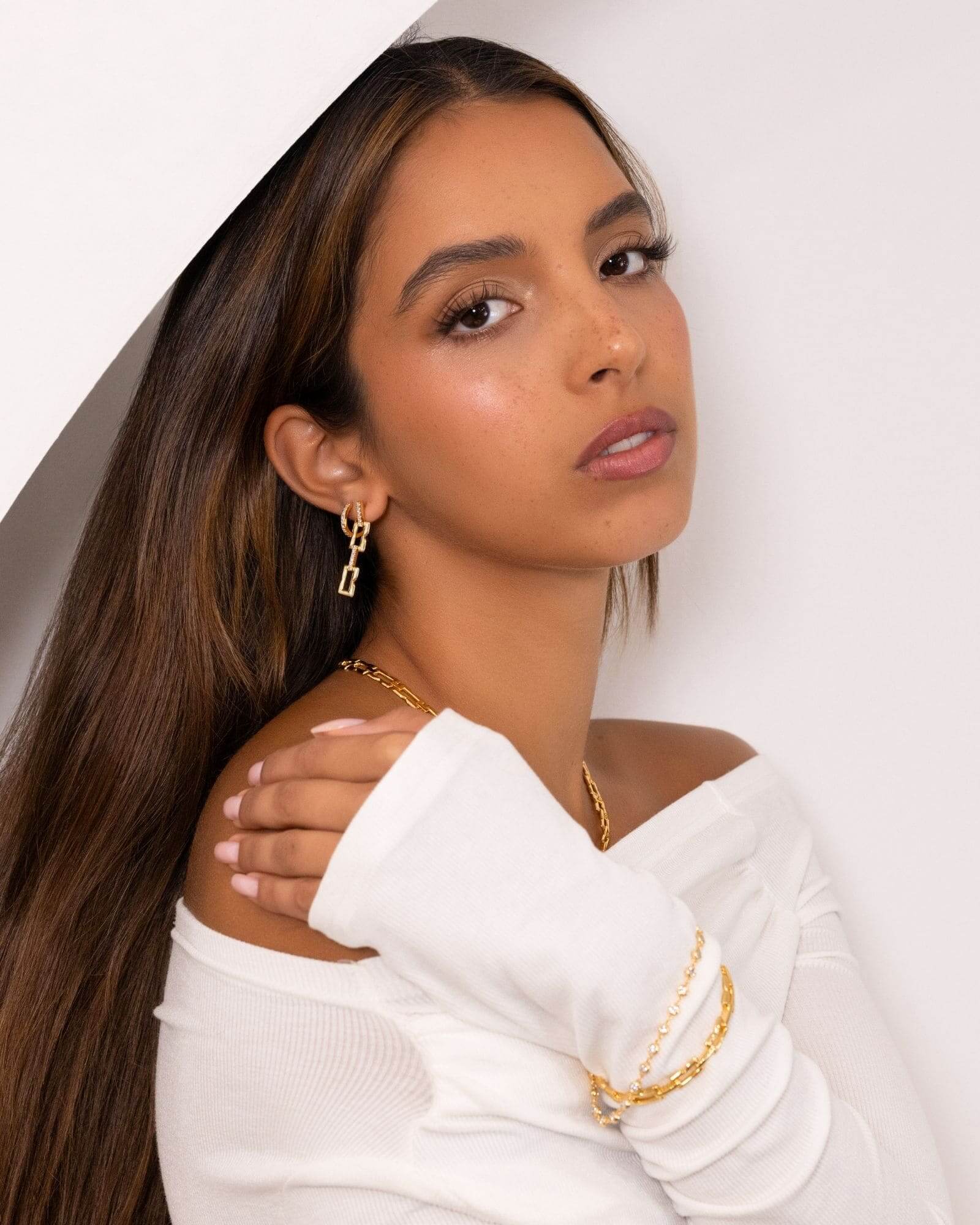 Lavana Signature Gold Diamond Earrings on model drop earrings in gold vermeil with lab grown diamonds