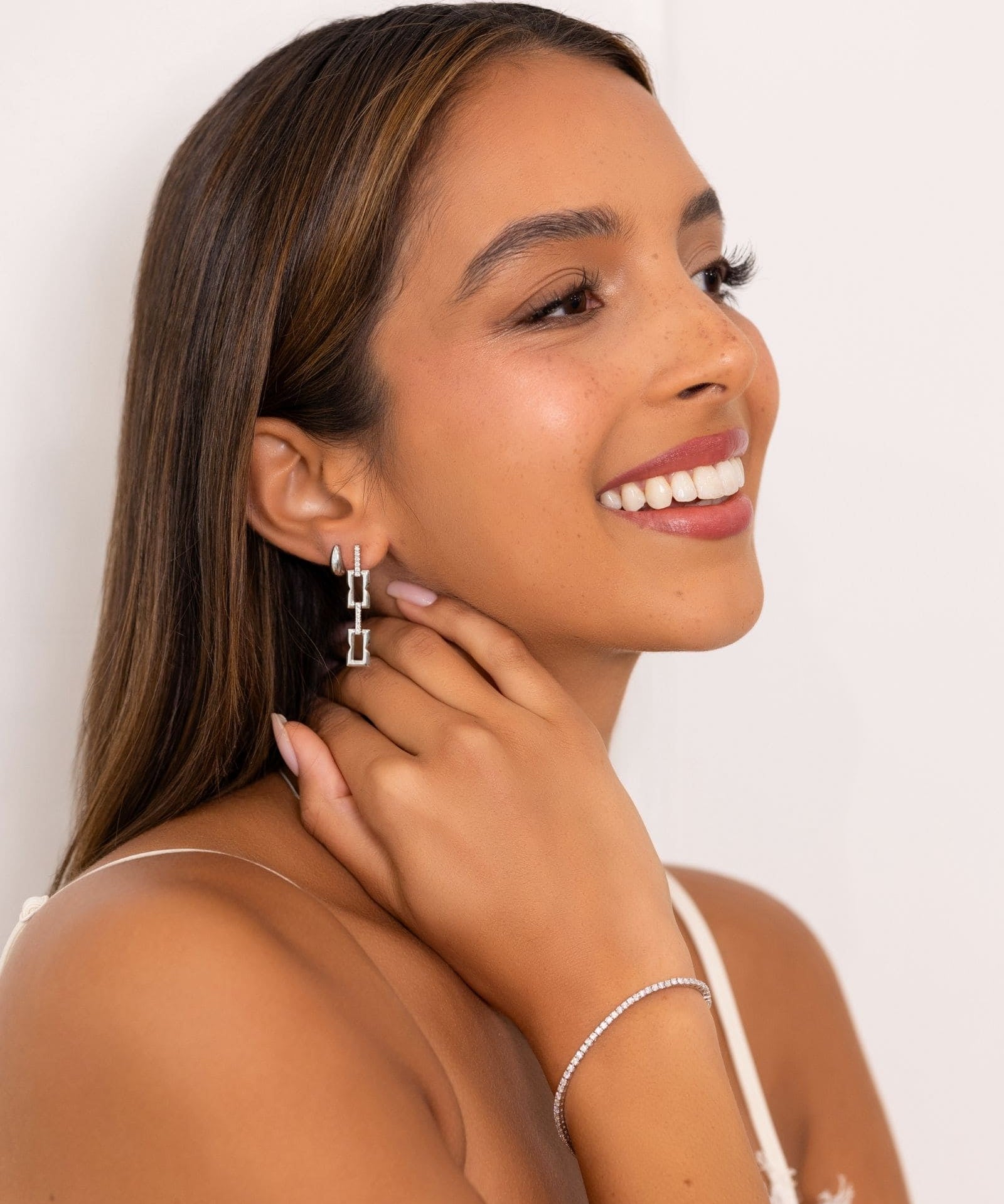 Lavana Signature Silver Diamond Earrings on model drop earrings in silver tone with lab grown diamonds