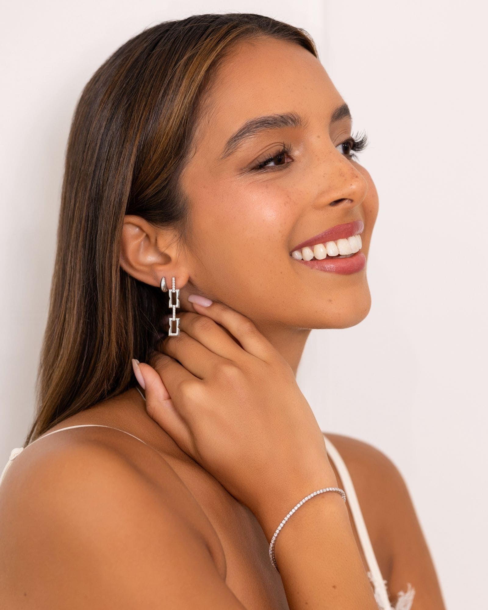 Lavana Signature Silver Diamond Earrings on model drop earrings in silver tone with lab grown diamonds