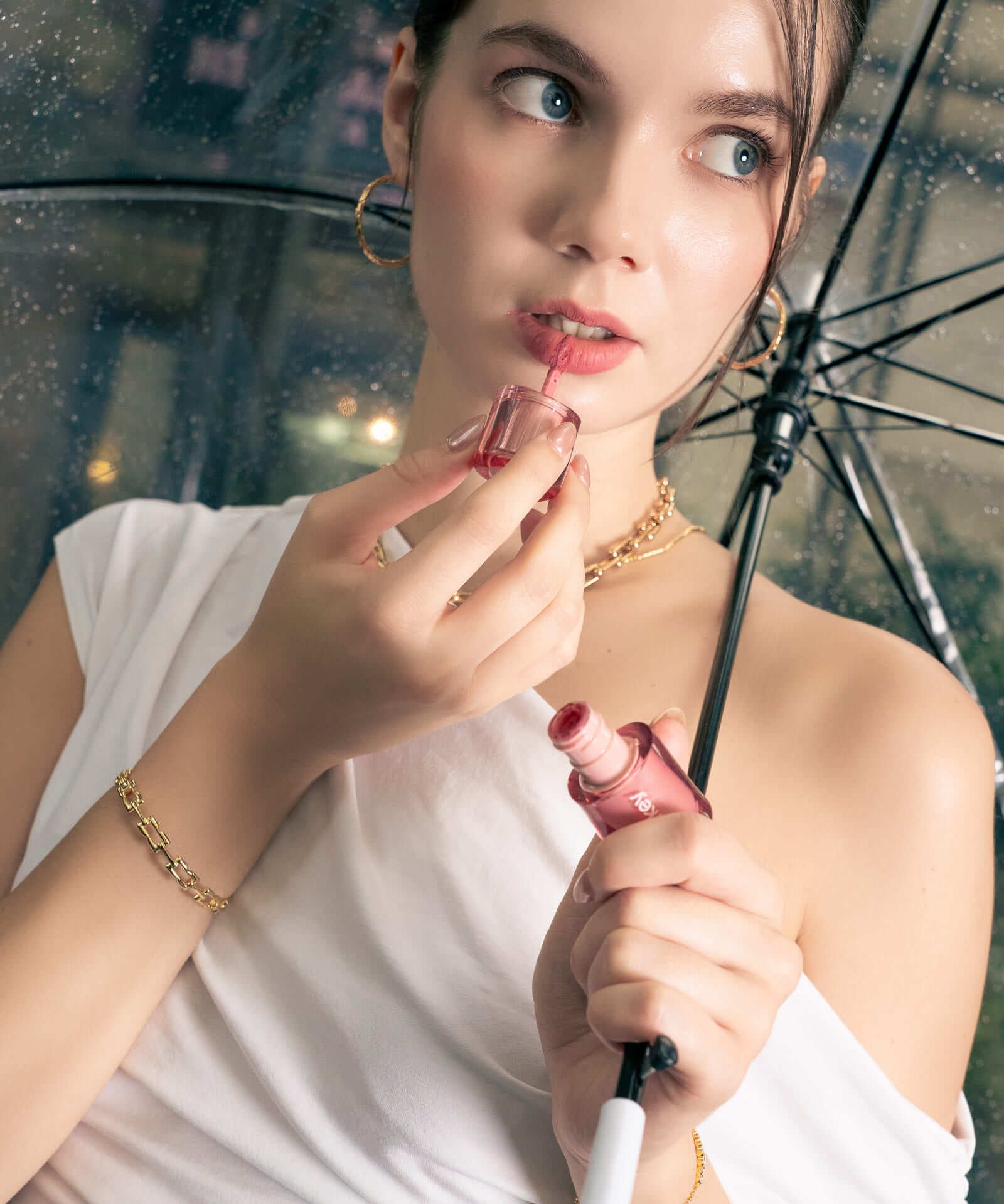 Lavana Signature gold bangle by Lavana, on model; with modern sculpted logo motif links