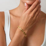 LAVANA Signature Gold Bracelet on model logo motif link with polished finish