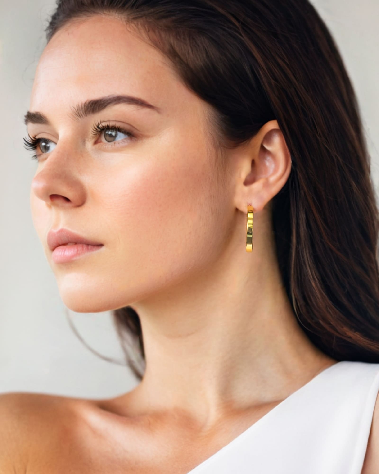 Luna Gold Extra Large Hoop Earrings by Lavana on model polished classic 4mm hoops available in four sizes
