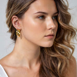 Luna Gold Hoop Earrings Medium and Large by Lavana on model polished classic 4mm hoops available in four sizes layered