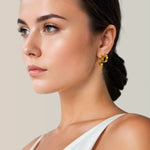 Luna Gold Hoop Earrings Small and Medium by Lavana on model polished classic 4mm hoops available in four sizes layered