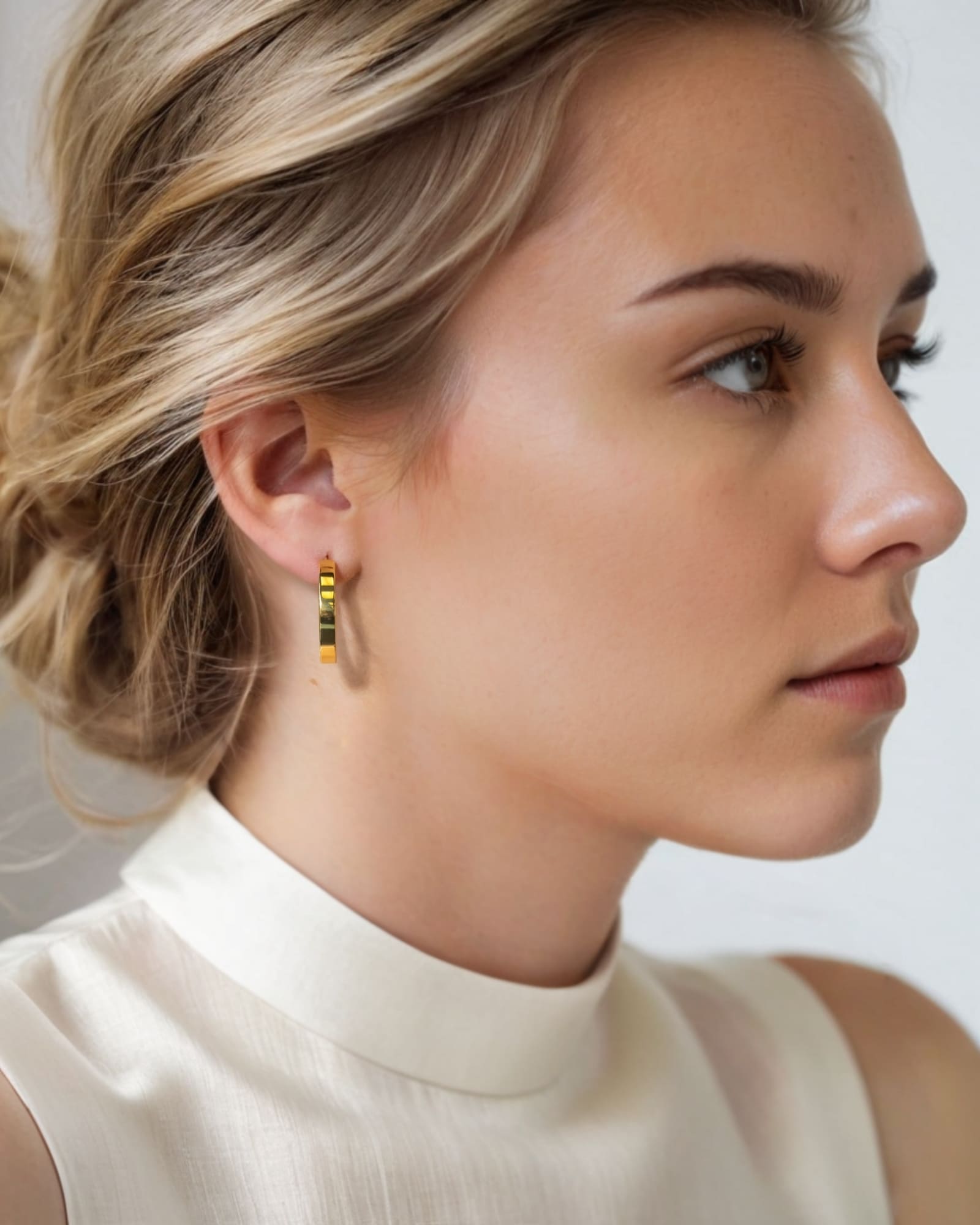 Luna Gold Large Hoop Earrings by Lavana on model polished classic 4mm hoops available in four sizes