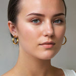 Luna Gold Large Hoop Earrings by Lavana on model polished classic 4mm hoops available in four sizes