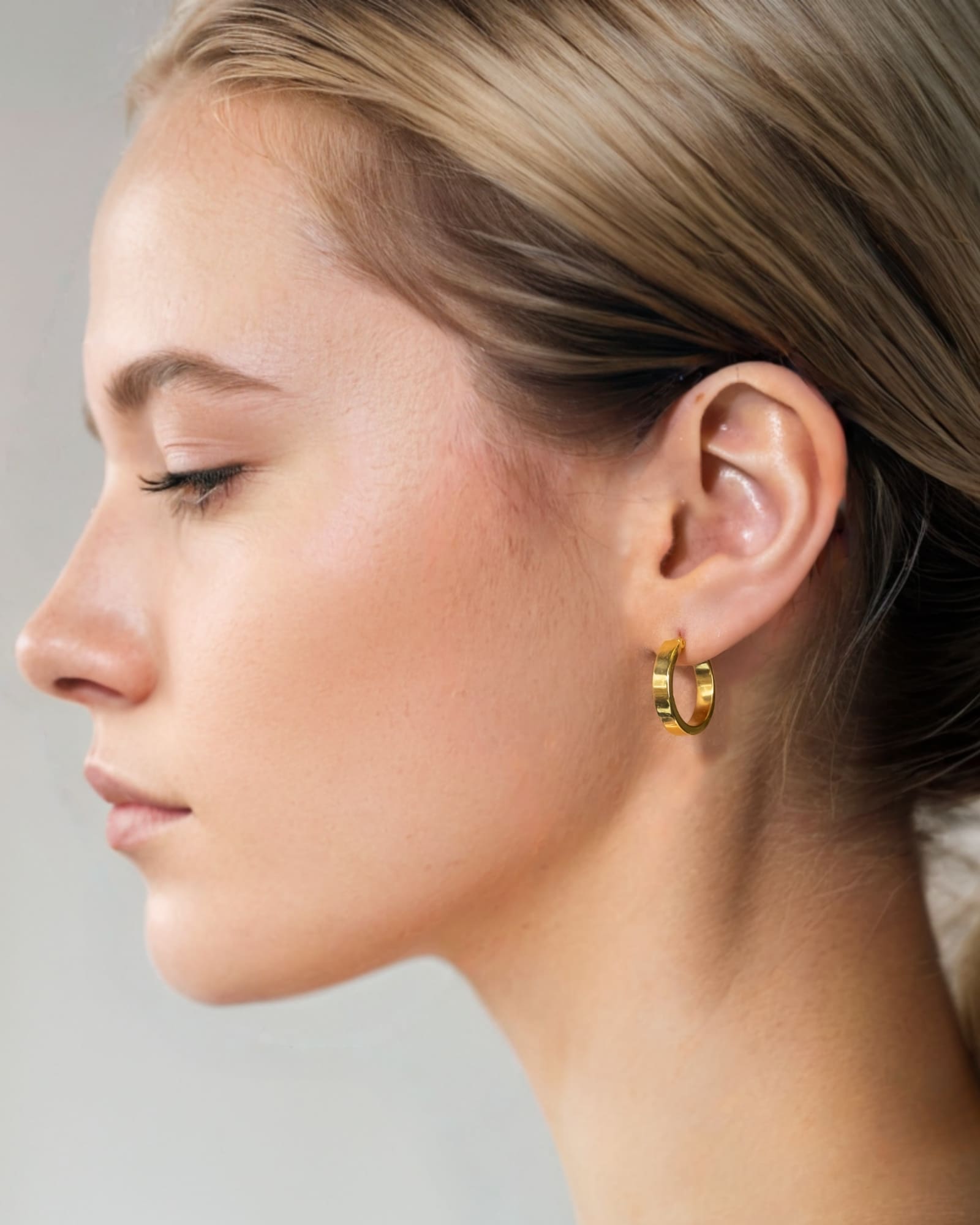 Luna Gold Medium Hoop Earrings by Lavana on model polished classic 4mm hoops available in four sizes