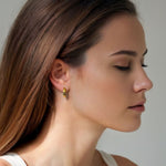 Luna Gold Small Hoop Earrings by Lavana on model polished classic 4mm hoops available in four sizes
