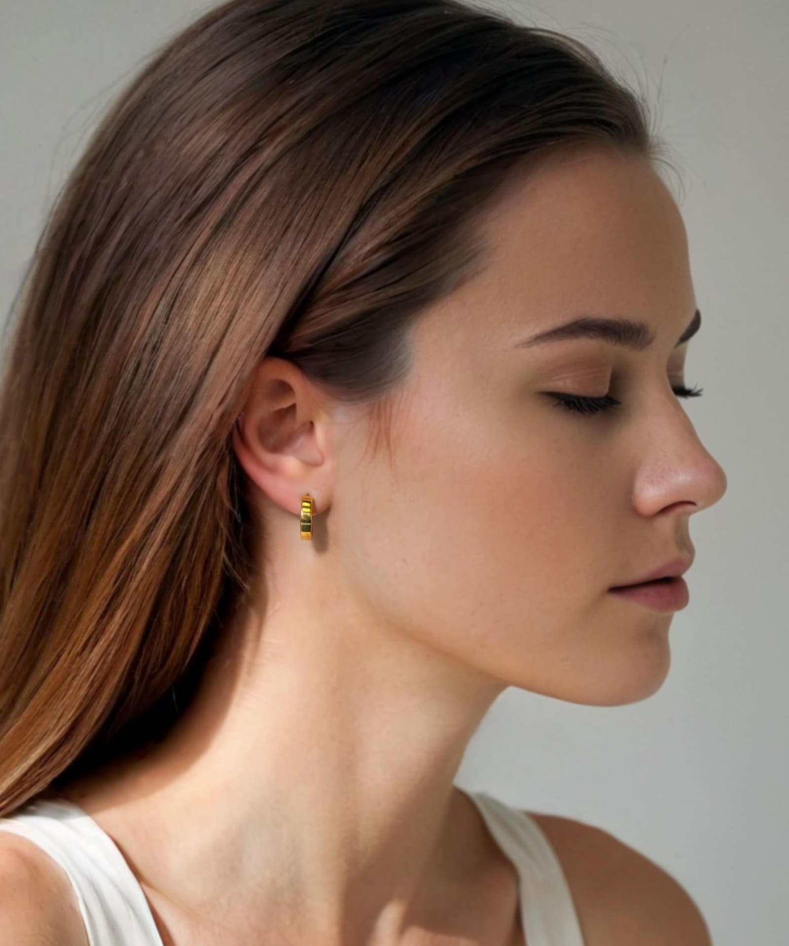 Luna Gold Small Hoop Earrings by Lavana on model polished classic 4mm hoops available in four sizes
