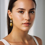 Majorca Gold Pearl Drop Earrings by Lavana, on model; organic open curves with central freshwater pearl 