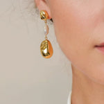Majorca Gold Pearl Drop Earrings by LAVANA on model organic open curves with central freshwater pearl