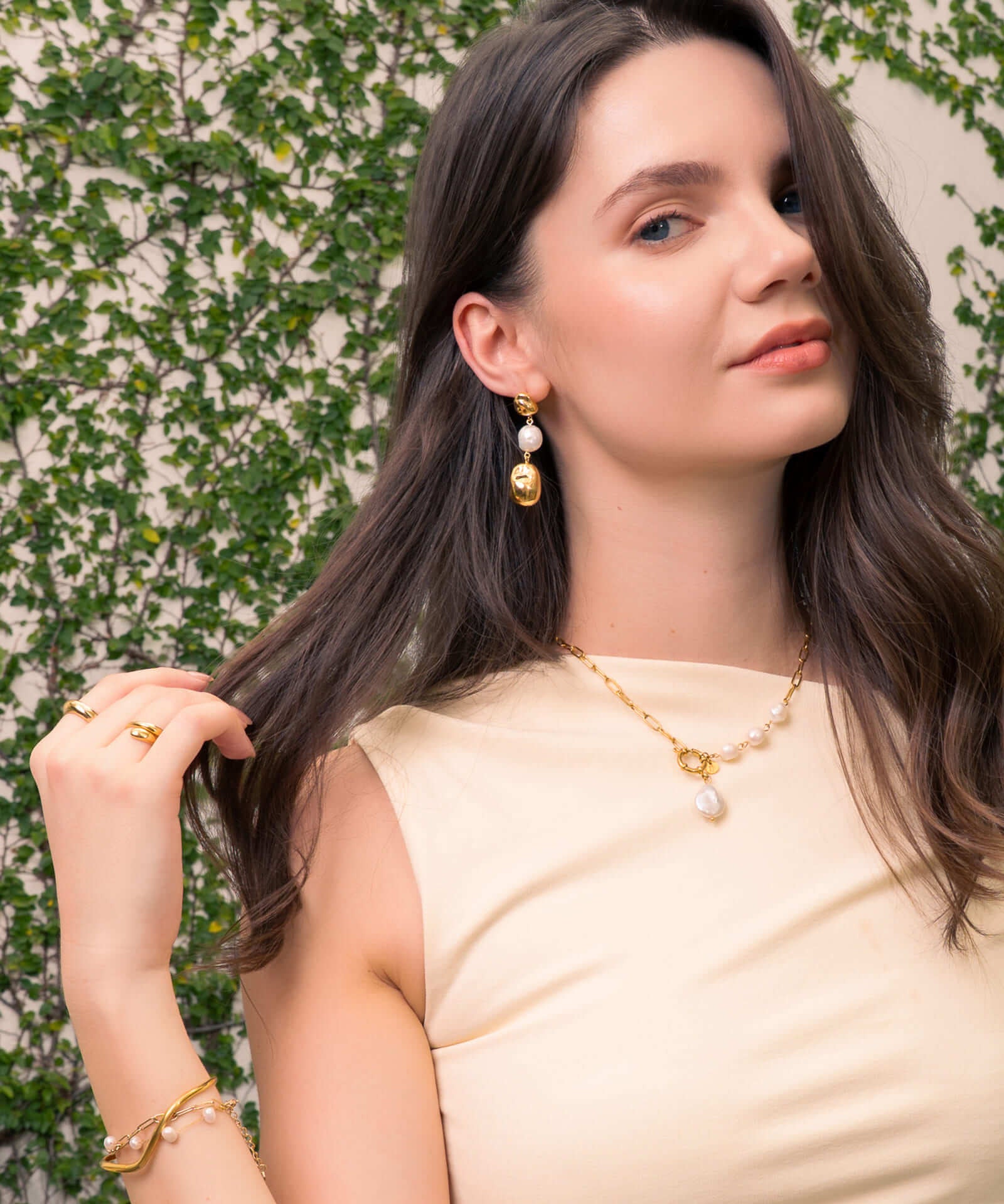 Majorca Gold Pearl Drop Earrings by Lavana, on model; classic organic open curves with central freshwater pearl