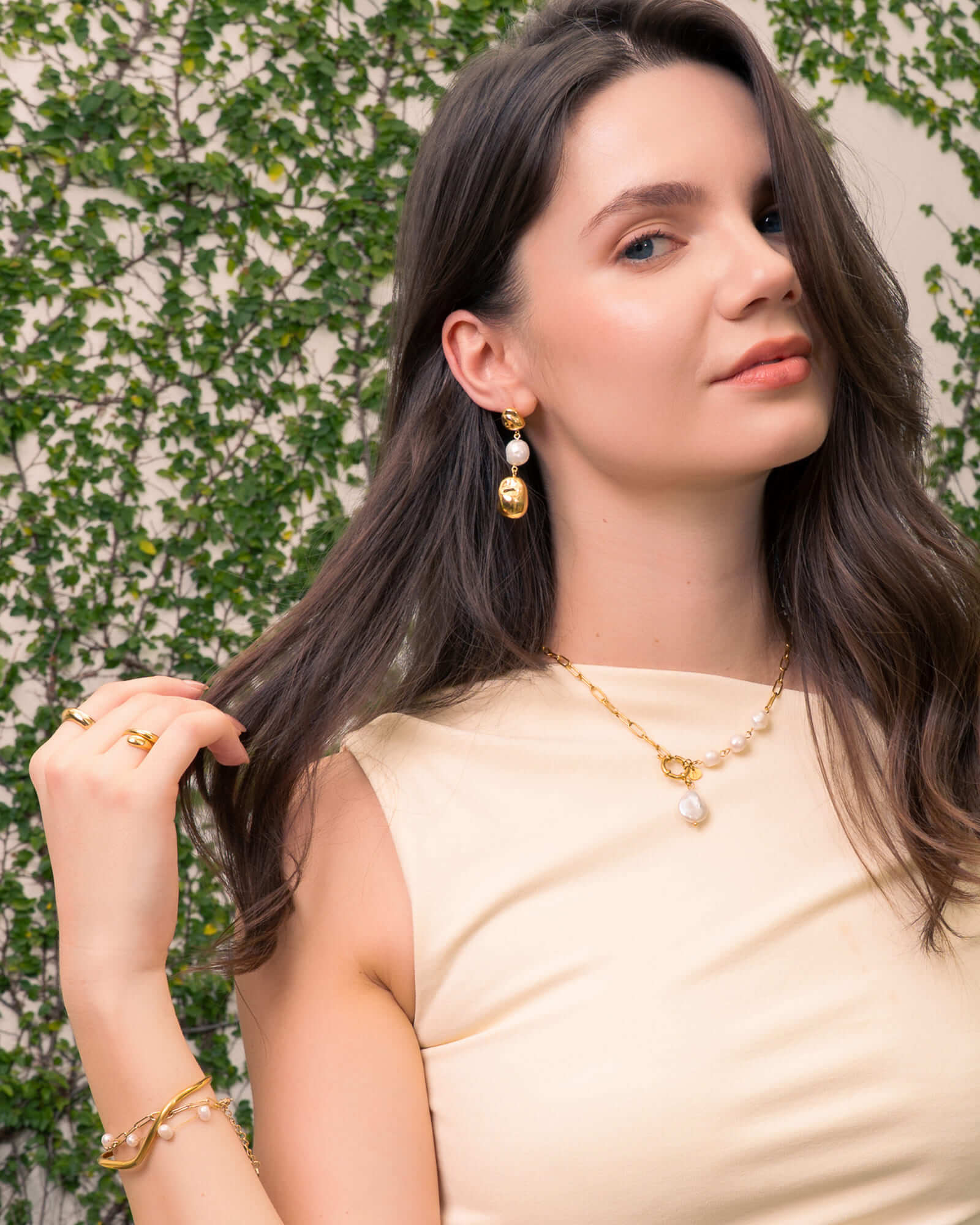 Majorca Gold Pearl Drop Earrings by Lavana, on model; classic organic open curves with central freshwater pearl