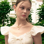 Mia Convertible Gold Hoop Earrings by LAVANA, on model; polished dress hoops with removable twisted ring drop