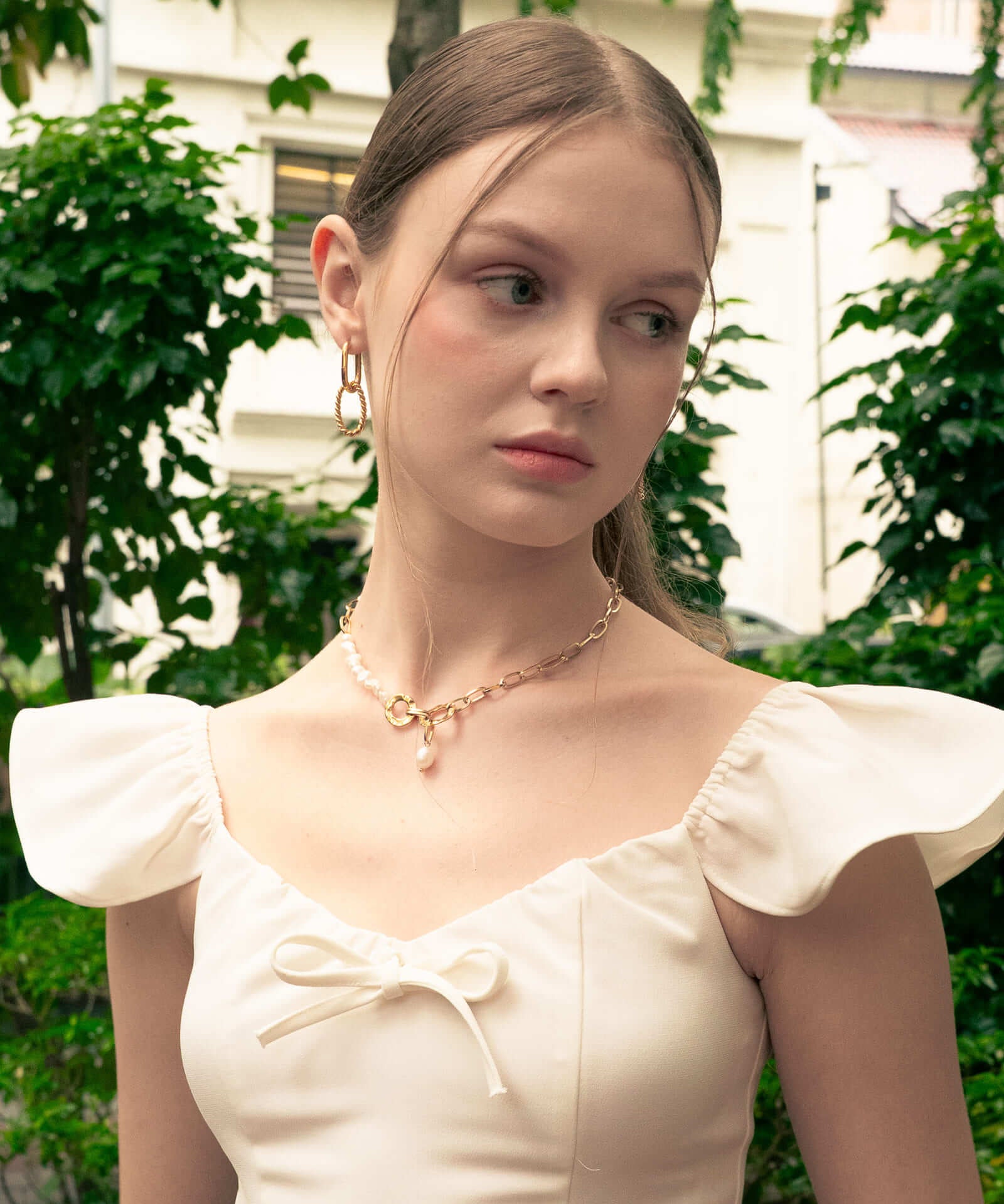 Mia Convertible Gold Hoop Earrings by LAVANA, on model; polished dress hoops with removable twisted ring drop