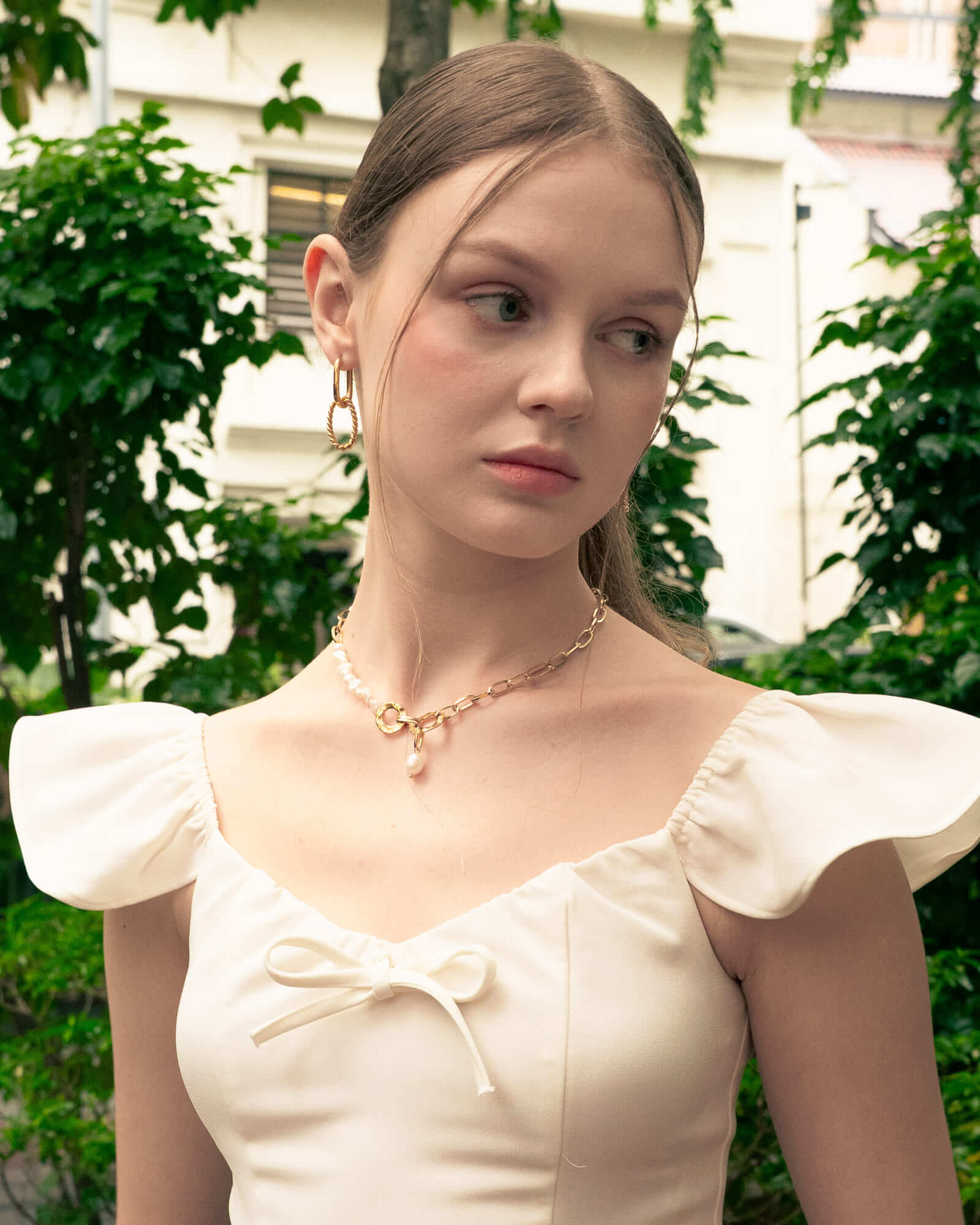 Mia Convertible Gold Hoop Earrings by LAVANA, on model; polished dress hoops with removable twisted ring drop