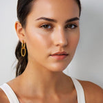 Mia Convertible Gold Hoop Earrings by Lavana, on model; polished hoop with removable twisted ring drop