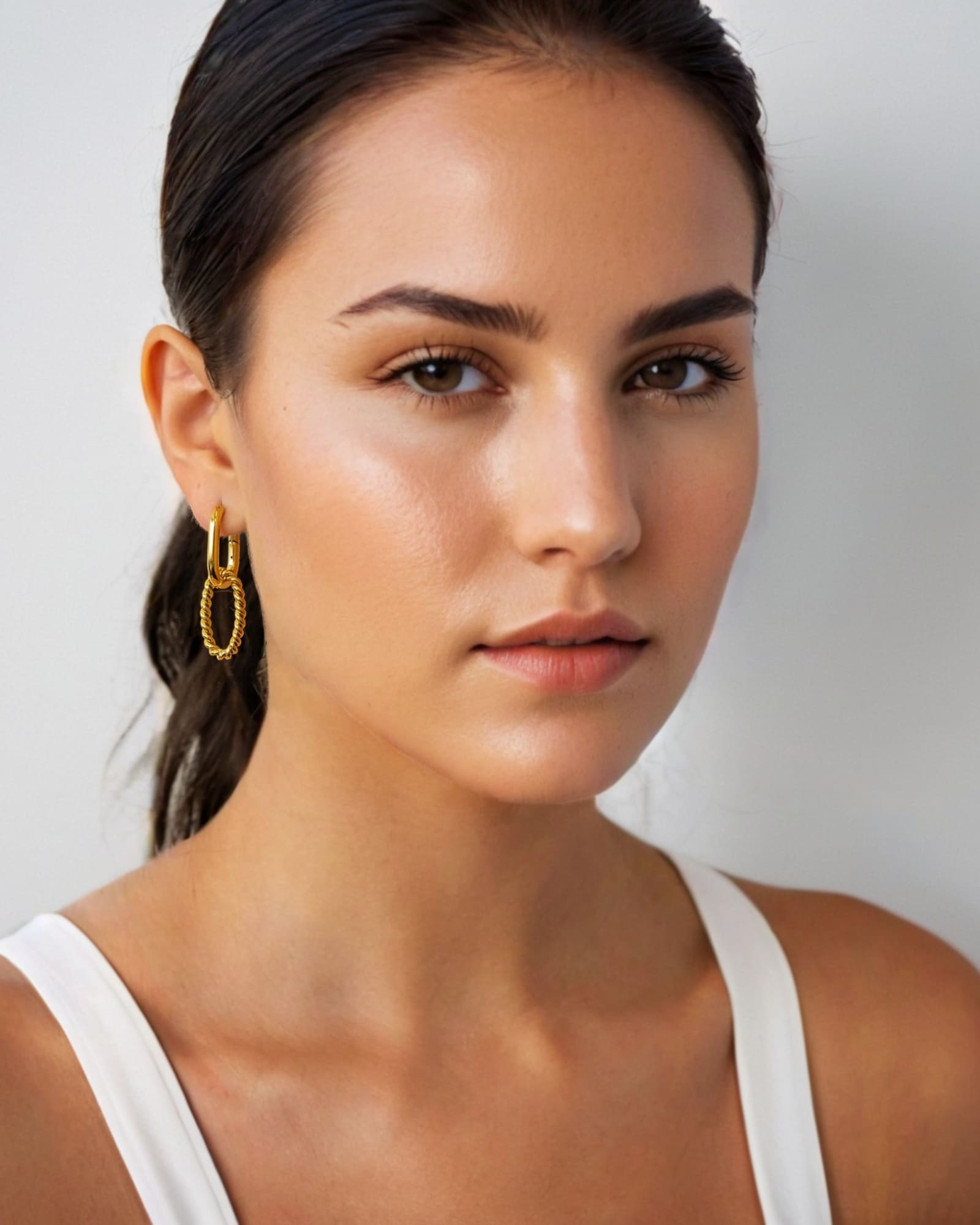 Mia Convertible Gold Hoop Earrings by Lavana, on model; polished hoop with removable twisted ring drop